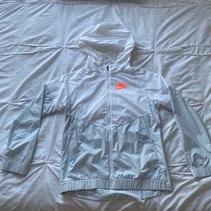 Grey and white Nike windbreaker